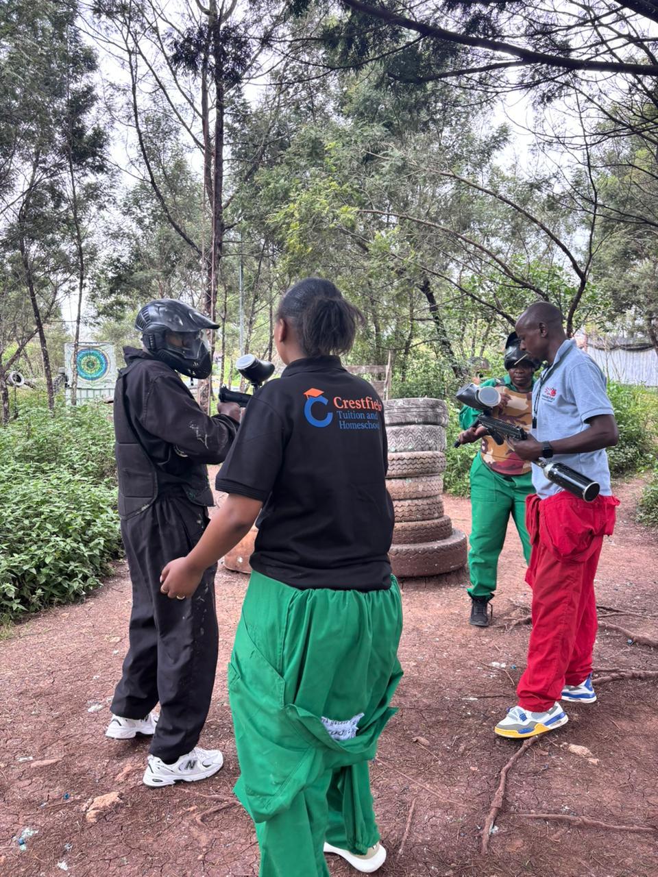 Crestfield students preparing for a guided outdoor paintball activity